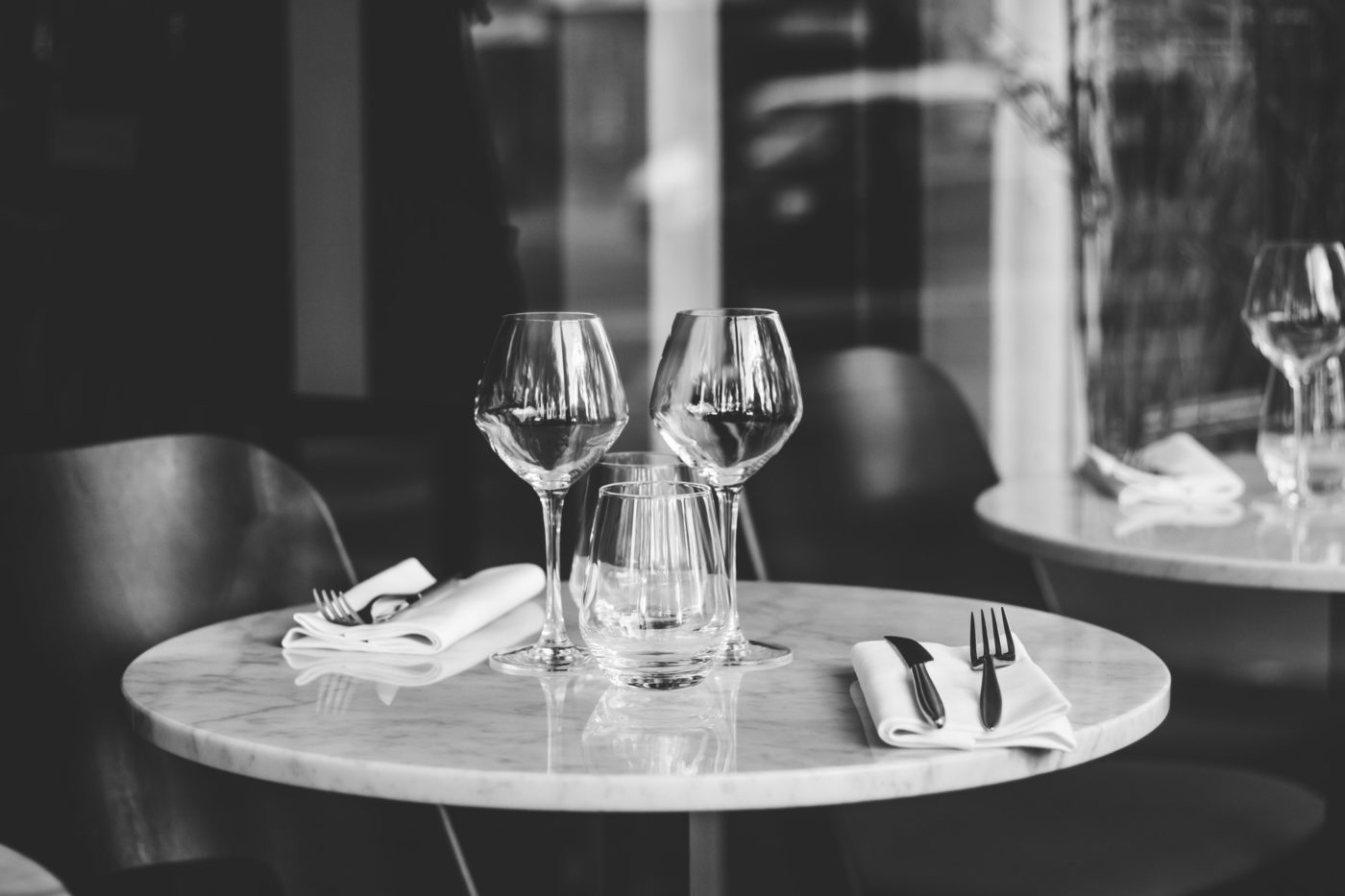 table setting in a french restaurant for two e1597982571544